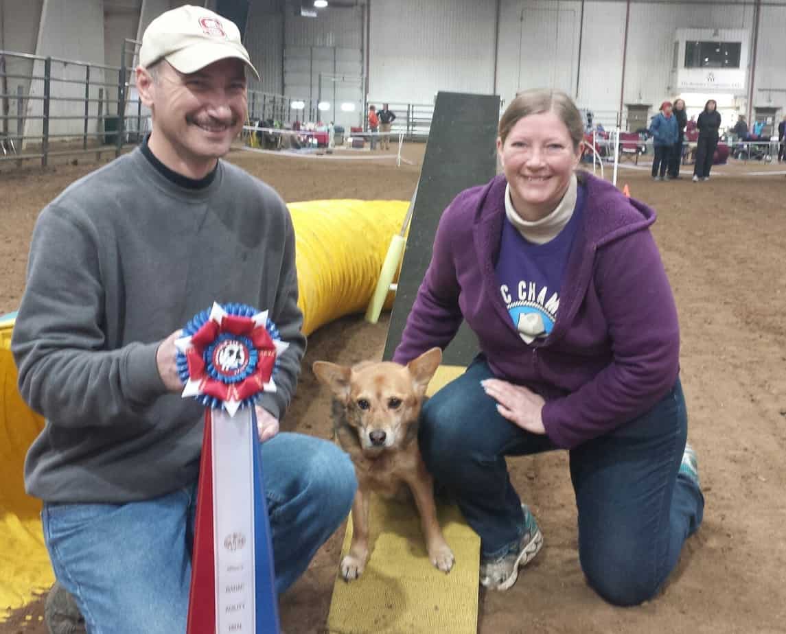 Dog agility people with ribbon